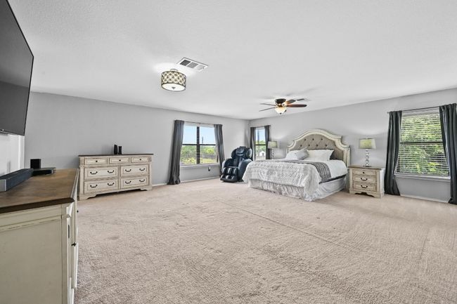 Bedroom featuring carpet flooring and a ceiling fan | Image 23