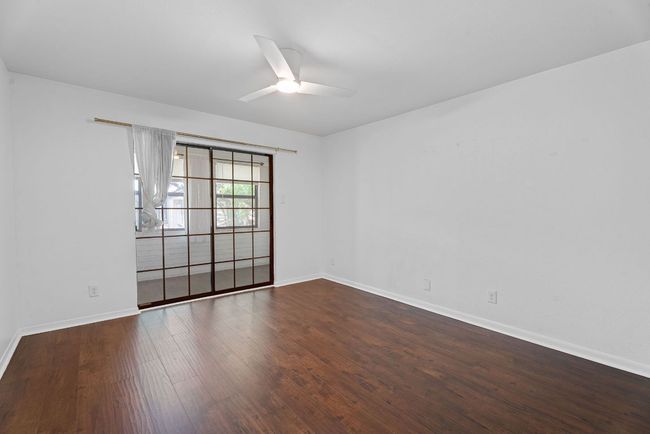 The primary suite comes with its own private enclosed porch plus a walk-in closet and ensuite bath. | Image 15