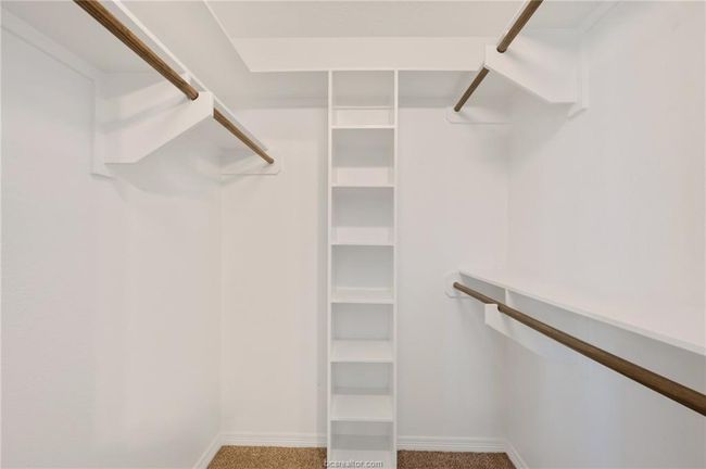 Spacious closet featuring carpet floors | Image 19
