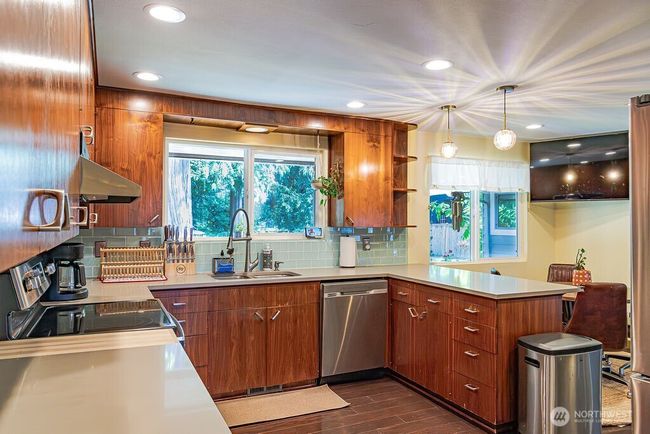 Another view of the kitchen and eat space. | Image 7