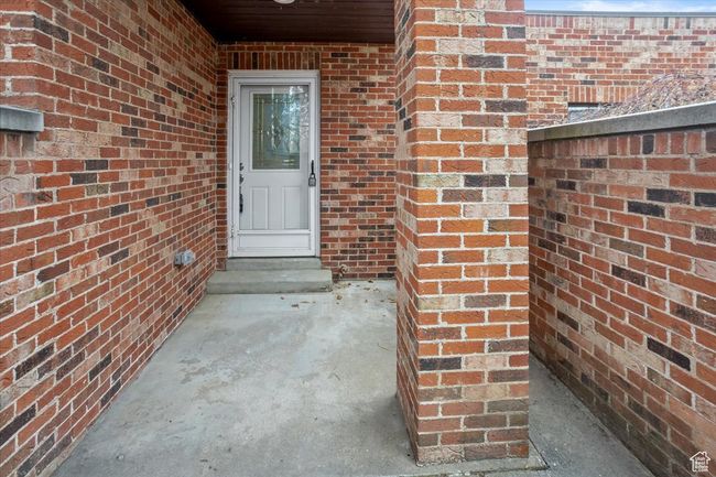 Entrance to property featuring brick siding | Image 37