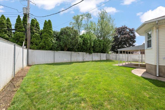 Fenced backyard featuring a patio | Image 25