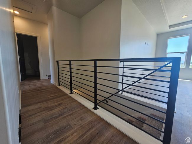 Hallway with an upstairs landing, wood finished floors, and baseboards | Image 14