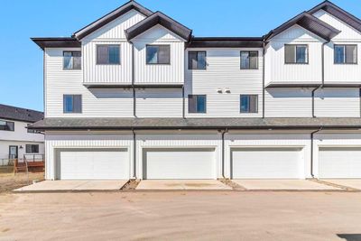 102 - 340 Ambleton St Nw, Home with 4 bedrooms, 2 bathrooms and 3 parking in Calgary AB | Image 2