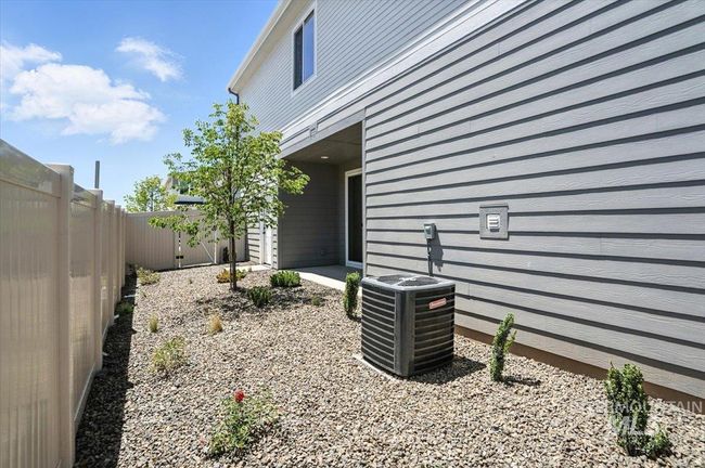 View of fenced backyard | Image 24