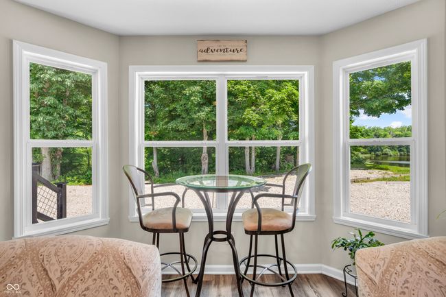 wall of windows makes for a great place to enjoy coffee or a glass of wine - notice the lake to the right... | Image 23