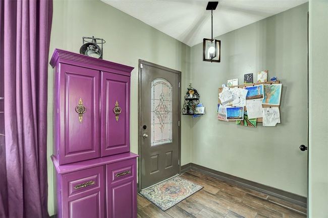 Welcoming view from the dining area to the inviting front entrance. | Image 6