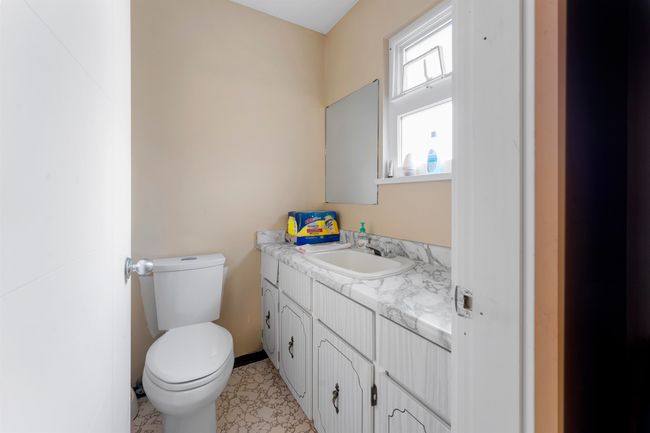 Bathroom with toilet and vanity | Image 20