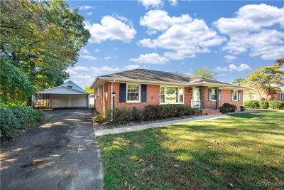 Single story home with a garage, a carport, a front lawn | Image 3