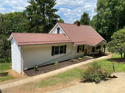 View of front of home with covered porch | Image 1