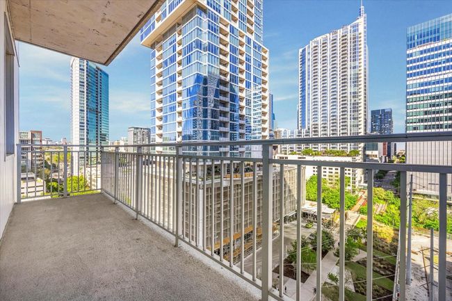 Balcony featuring a city view | Image 14