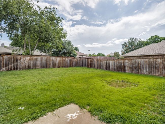 View of fenced backyard | Image 9