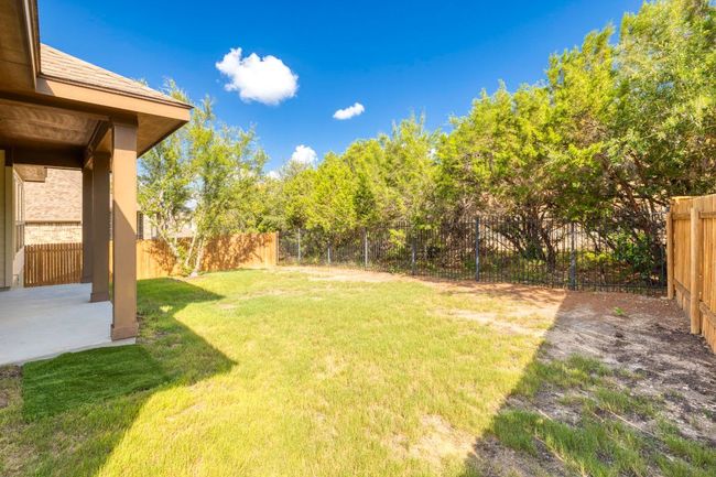 Fenced backyard featuring a patio | Image 28