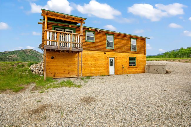 Back of property with a mountain view | Image 29