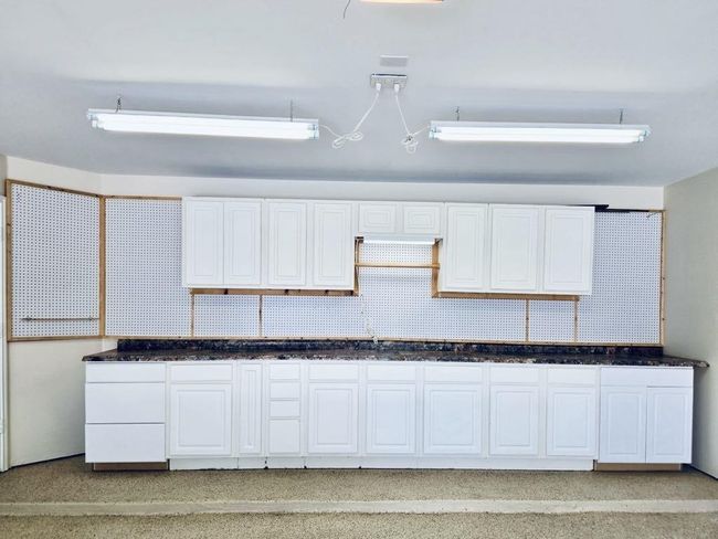 The built-in cabinets are perfect for organizing tools, seasonal décor, car supplies, and more. A savvy storage upgrade for every lifestyle! | Image 35