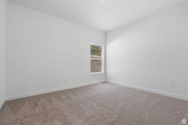 Carpeted spare room featuring baseboards | Image 8