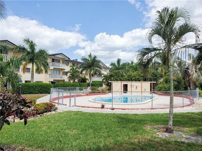 Community pool featuring a lawn and fence | Image 24