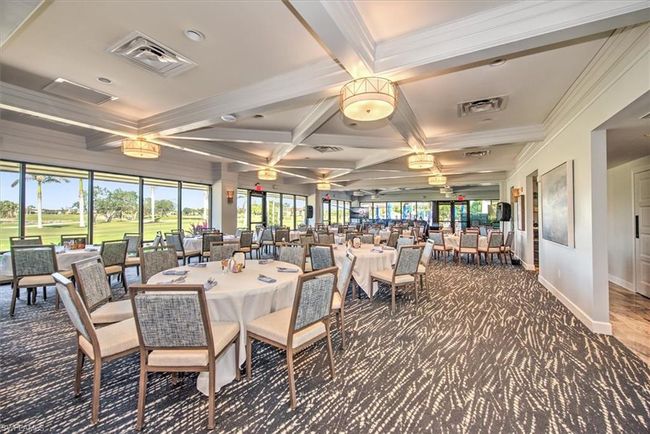 Dining room with coffered ceiling, beamed ceiling, carpet flooring, and crown molding | Image 34