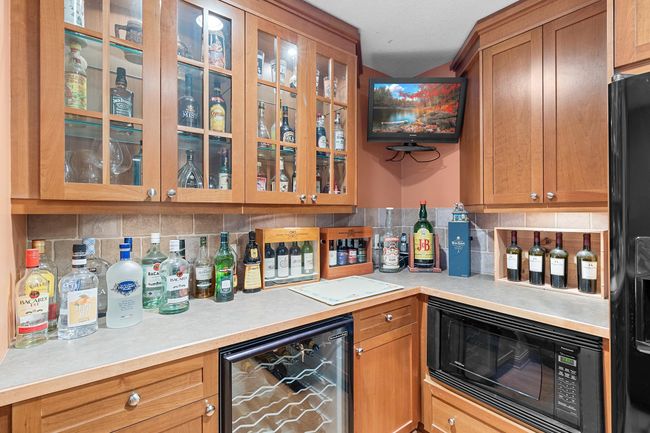Lower-level recreation room wet bar. | Image 46