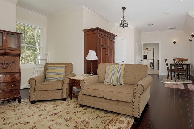 Living area in the upstairs apartment with walk-in closet and breakfast room too! | Image 24