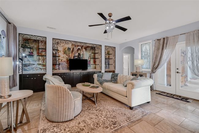 Living room featuring french doors, light tile patterned floors, and ceiling fan | Image 17