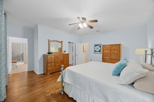 Another view of the primary bedroom showing the door to the ensuite bathroom. | Image 23
