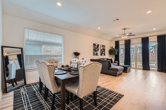 Dining room featuring light wood-style flooring, visible vents, recessed lighting, and ceiling fan | Image 8