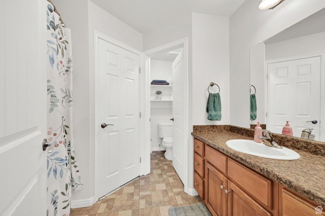 Bathroom featuring toilet and vanity | Image 21