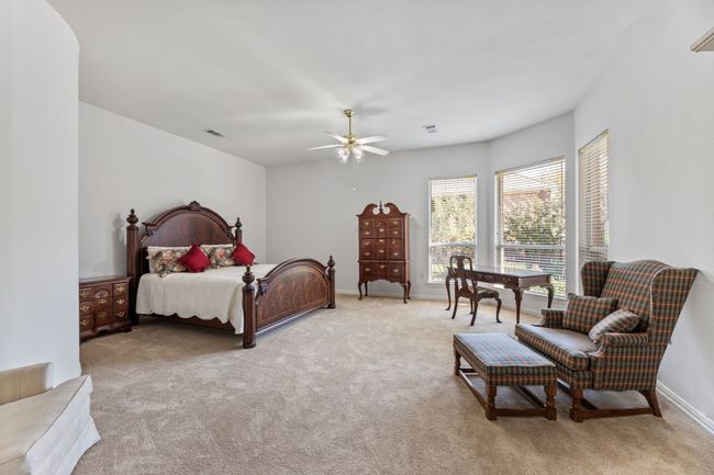 Bedroom with light carpet and ceiling fan | Image 26