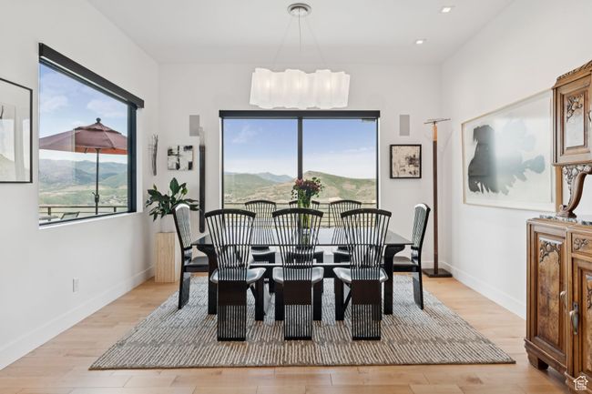 Dining space with light wood-style flooring, recessed lighting, and a chandelier | Image 20