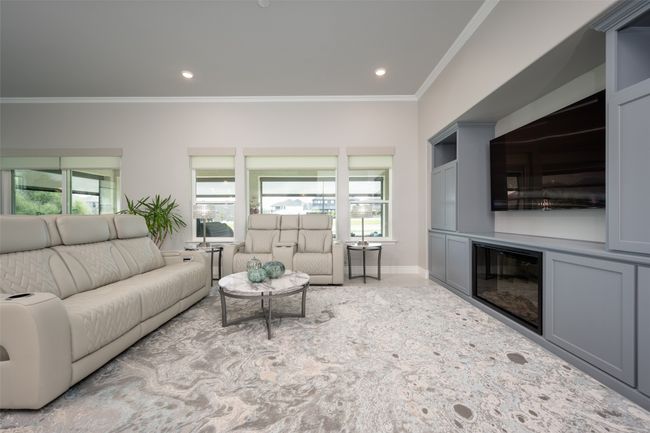Living room overlooking covered patio | Image 7