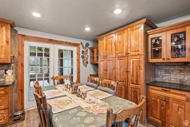 Dining area with recessed lighting, wood finished floors, and french doors | Image 7