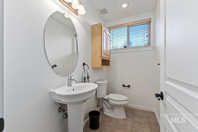 Half bathroom with tile patterned floors and recessed lighting | Image 44