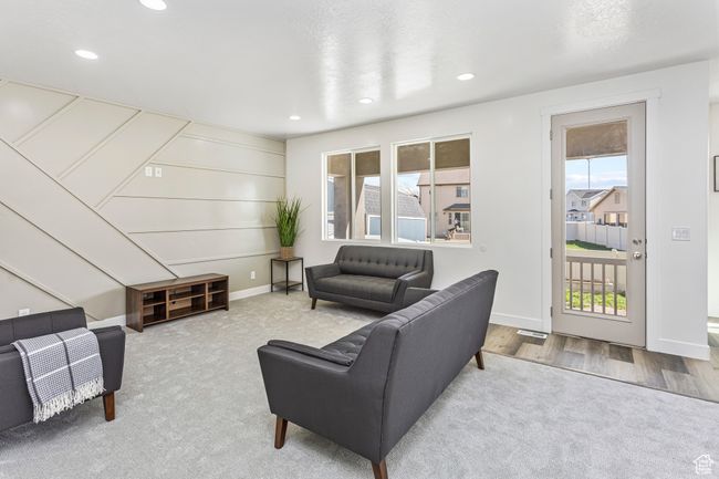 Carpeted living room with recessed lighting and baseboards | Image 10
