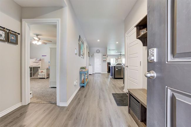 Foyer entrance featuring light wood finished floors, a ceiling fan, and recessed lighting | Image 5