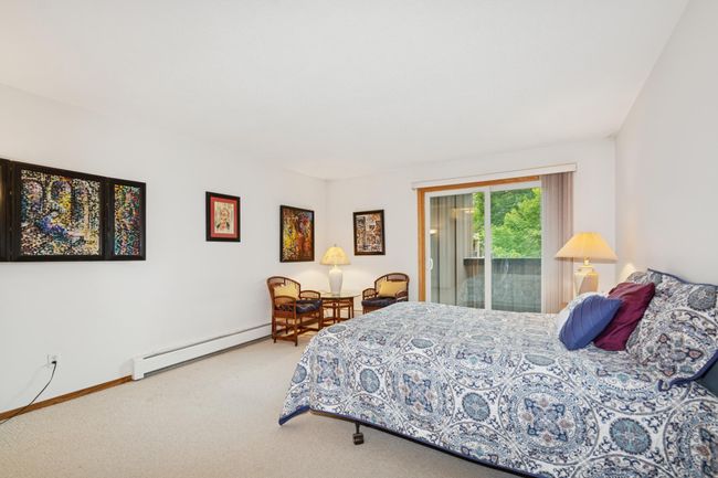 Large owner suite with private balcony, two large closets and 3/4 bath | Image 12