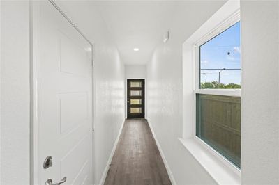 Hall with wood-type flooring | Image 2