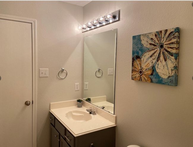 Half bath featuring vanity and a textured wall | Image 14
