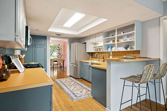 Breakfast bar connects seamlessly to the sunny dining nook | Image 4