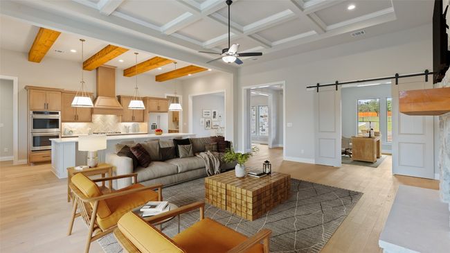 Living area with ceiling fan, beamed ceiling, light wood-style floors, recessed lighting, and a barn door | Image 8
