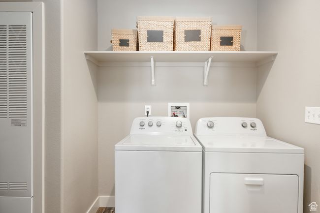Clothes washing area with a heating unit and separate washer and dryer | Image 13
