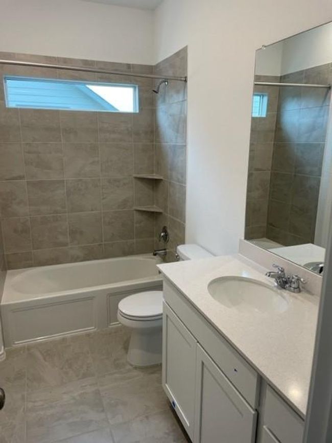 Full bathroom with tub / shower combination, toilet, and vanity | Image 12