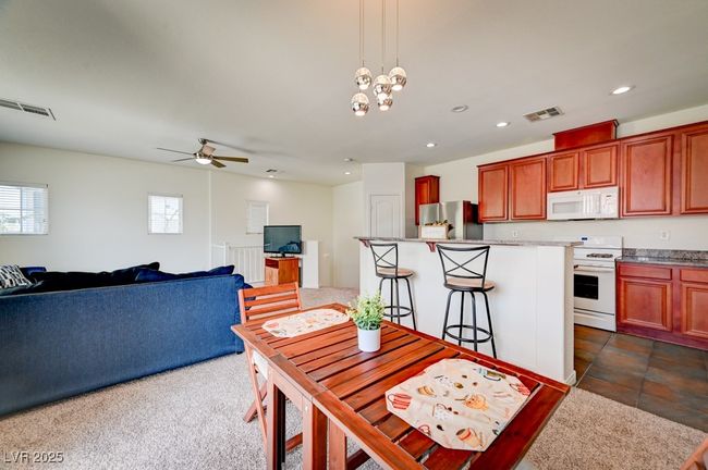 Dining area featuring plenty of natural light, a ceiling fan, and recessed lighting | Image 9