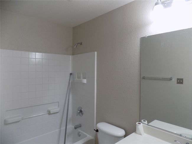 Full bathroom featuring bathtub / shower combination and vanity | Image 25
