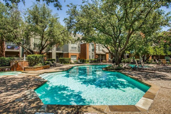 Community pool with a patio | Image 25