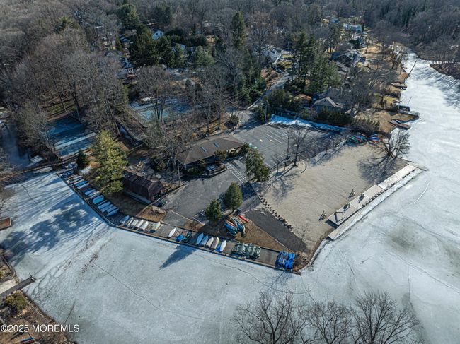 Pines Lake in Wayne, New Jersey, is a private lakeside community that offers a harmonious blend of natural beauty and modern amenities. Established in 1927, this serene enclave is centered around a picturesque man-made lake, providing residents with year-round recreational opportunities. | Image 54