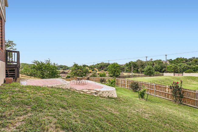 View of yard with a patio and stairs | Image 25