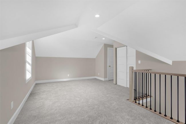 Additional living space with lofted ceiling, baseboards, carpet flooring, and recessed lighting | Image 18