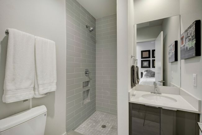 Ensuite bathroom featuring tiled shower and vanity | Image 20