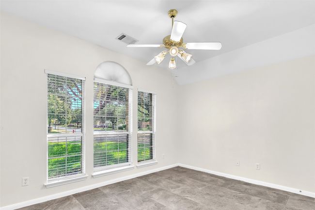Spare room featuring baseboards and a ceiling fan | Image 20